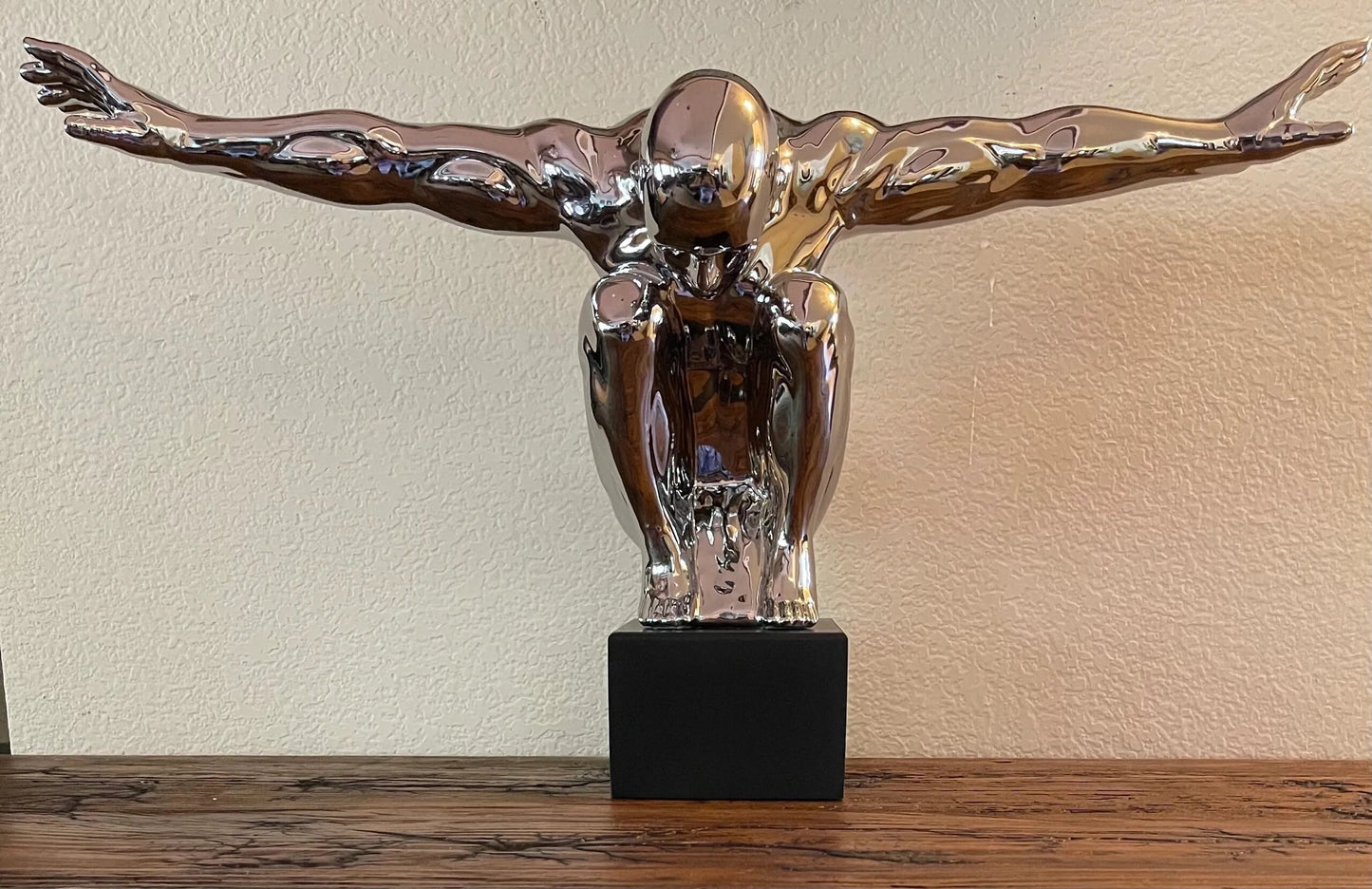 Silver Man Sculpture with Arms Out