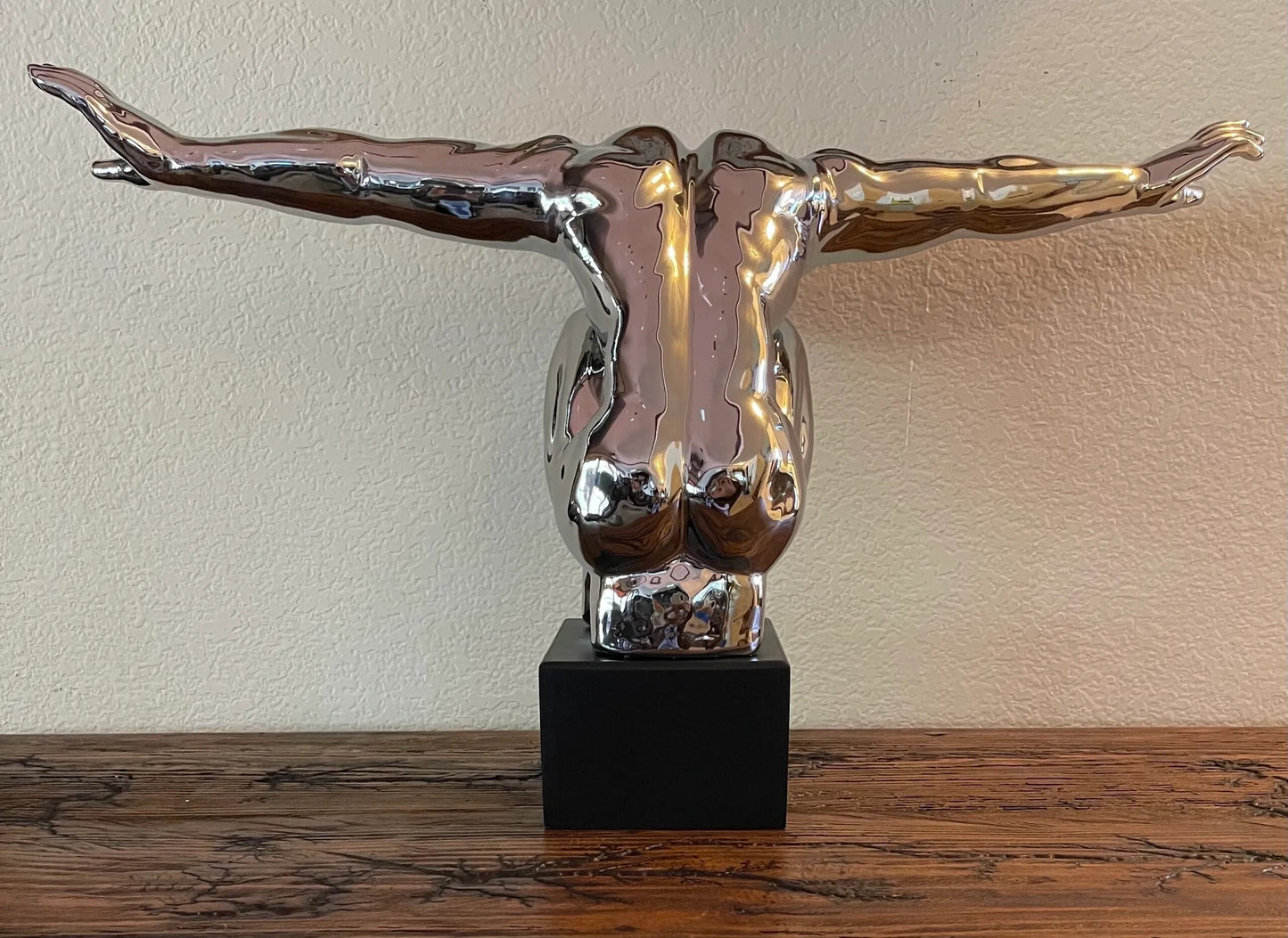 Silver Man Sculpture with Arms Out